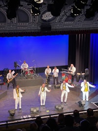 a group of men on stage